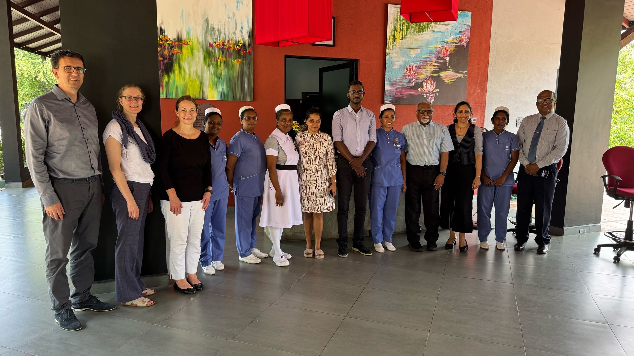 group_photo_with_staff_at_health_facility.jpg