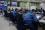 Workers monitor the plant from the Emergency Response Centre. A live CCTV image of Units 1 and 2 appears on the screen behind. Due to high on-site radiation, many instruments have to be monitored remotely via CCTV.