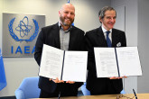 IAEA Director General Rafael Mariano Grossi and Jamie Cooke, General Manager Warner Bros. Discovery for Central Europe, Middle East & Turkey, signs the agreement between the International Atomic Energy Agency and the Discovery Channel at the Agency headquarters in Vienna, Austria. 12 December 2024