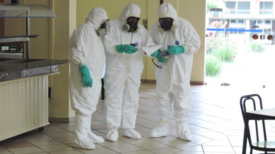 emergency men in hazard suits