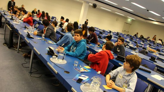 The younger students interviewing Programme Management Officers from the Department of Technical Cooperation