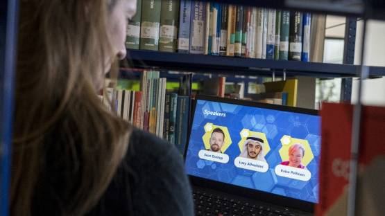 Woman stares at a screen